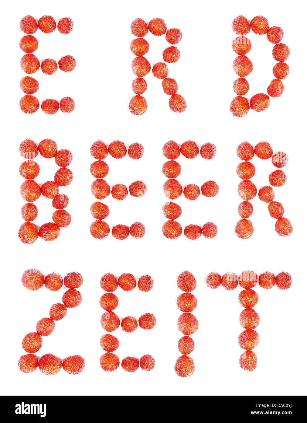 the german word Erdbeerzeit layed out using fresh strawberries Stock Photo