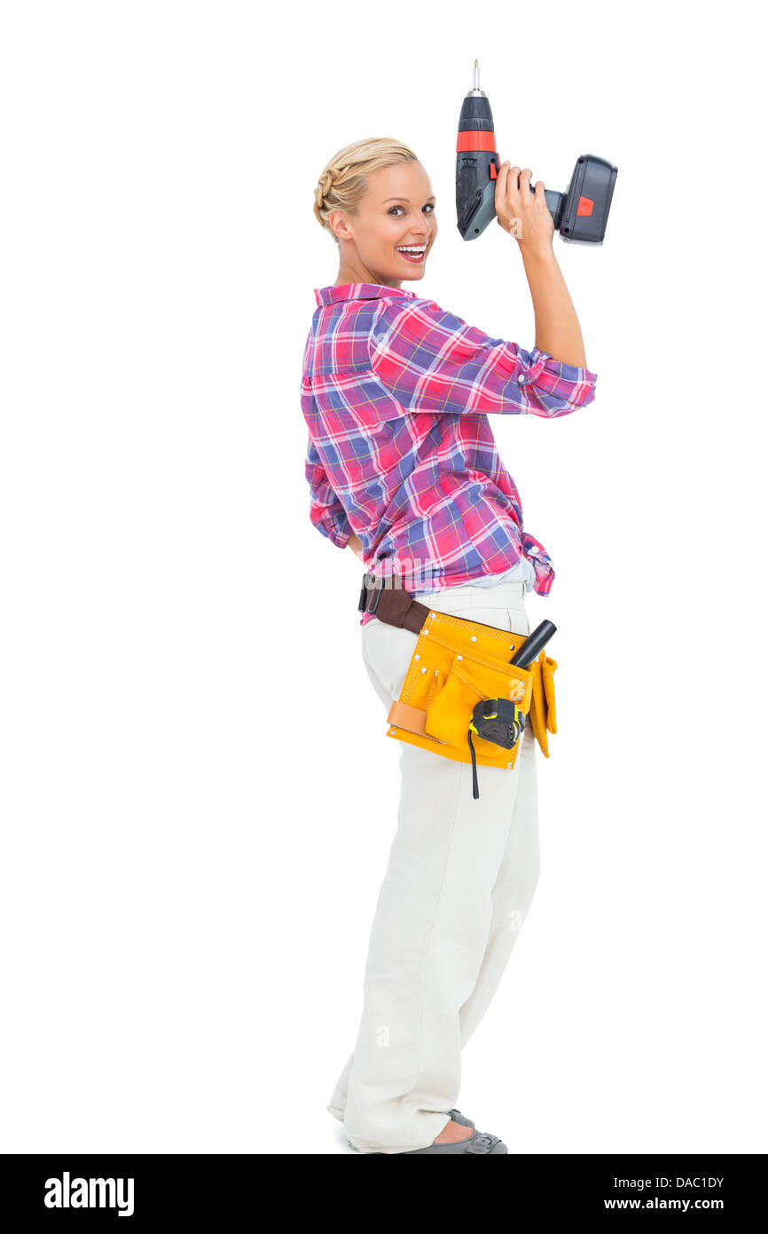 Blonde Woman Standing Holding A Drill Stock Photo - Alamy