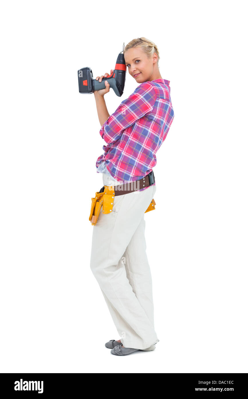 Woman standing with a power drill Stock Photo - Alamy