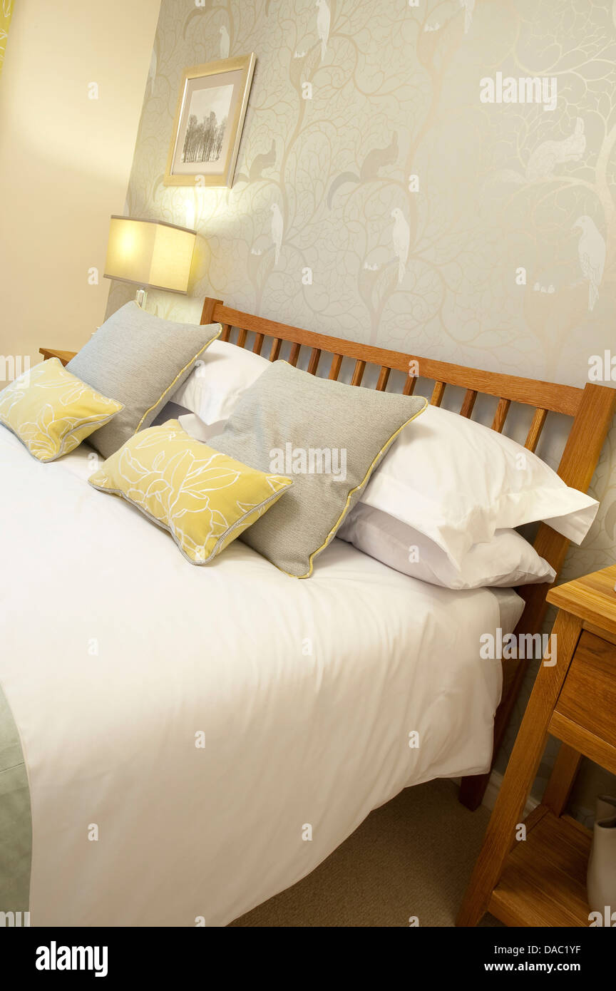 Double bed in a bedroom in a modern property Stock Photo Alamy