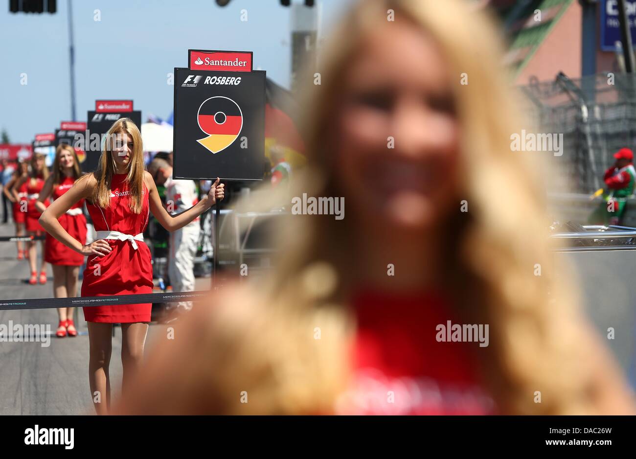 Grid girls seen at the Nuerburgring circuit in Nuerburg, Germany, 07 July 2013. Photo: Jens Buettner/dpa Stock Photo