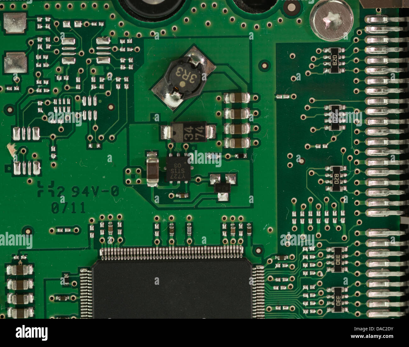 Green Electrical Circuit Board with microchips, conductors, and ...