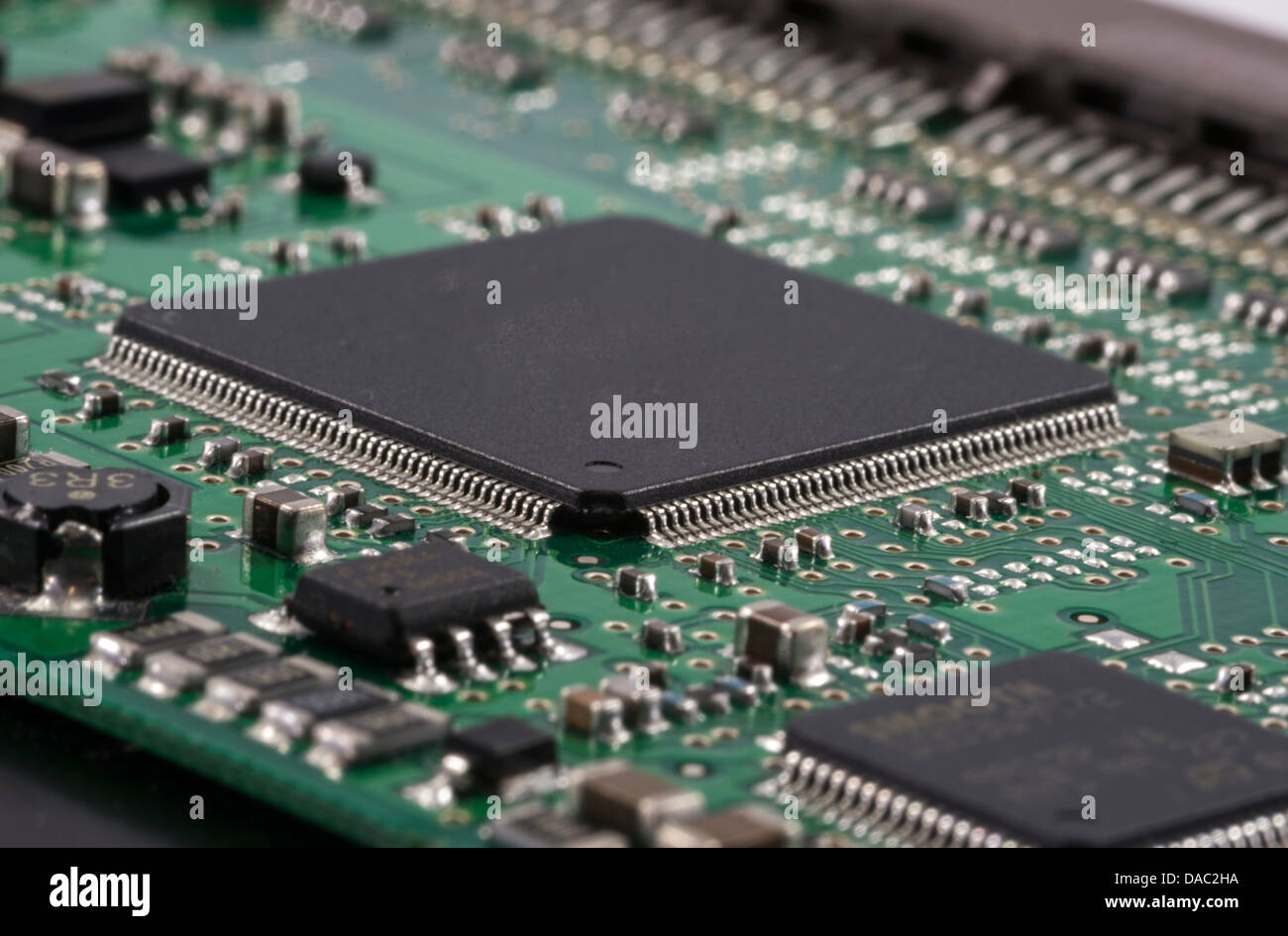 Green Electrical Circuit Board with microchips, conductors, and