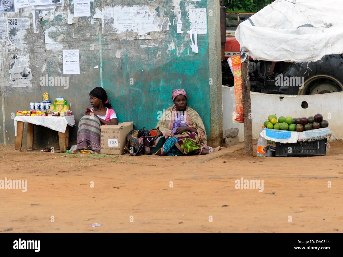 Women sell goods on the side of a road in Xai-Xai, Mozambique, 02 March