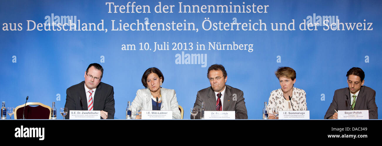 (L-R) Thomas Zwiefelhofer (VU), minister for interior affairs, justice, and economy of Liechtenstein, Austrian interior minister Johanna Mikl-Leitner (OeVP), German interior minister Hans-Peter Friedrich (CSU), Simonetta Sommaruga (SP), head of the Swiss justice and police department (EJPD), and Markus Beyer-Pollok, vice spokesman at the German interior ministry, answer questions of journalists at a press conference of a meeting of interior ministers from German speaking countries in Nuremberg, Germany, 10 July 2013. The ministers want to talk about human trafficking, immigration, and integrat Stock Photo