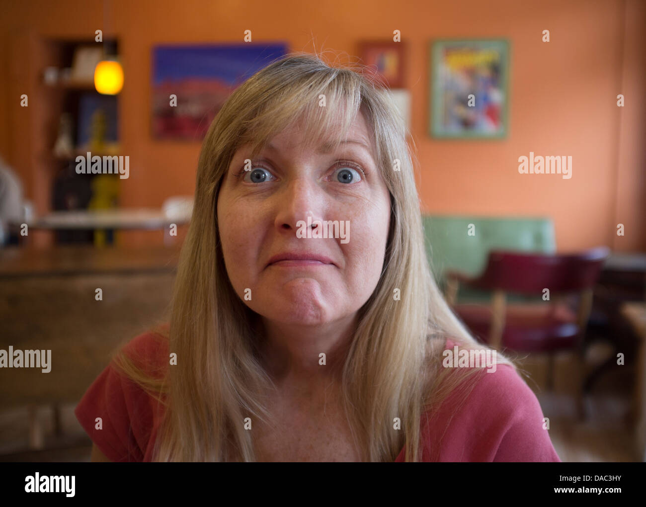 Closeup of woman with eyes wide open looking at the camera Stock Photo Alamy