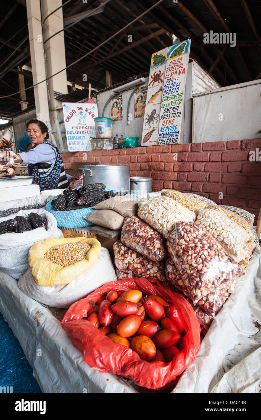 Inca woman tends her produce stall shop at the local market in downtown Cusco, Peru. Stock Photo