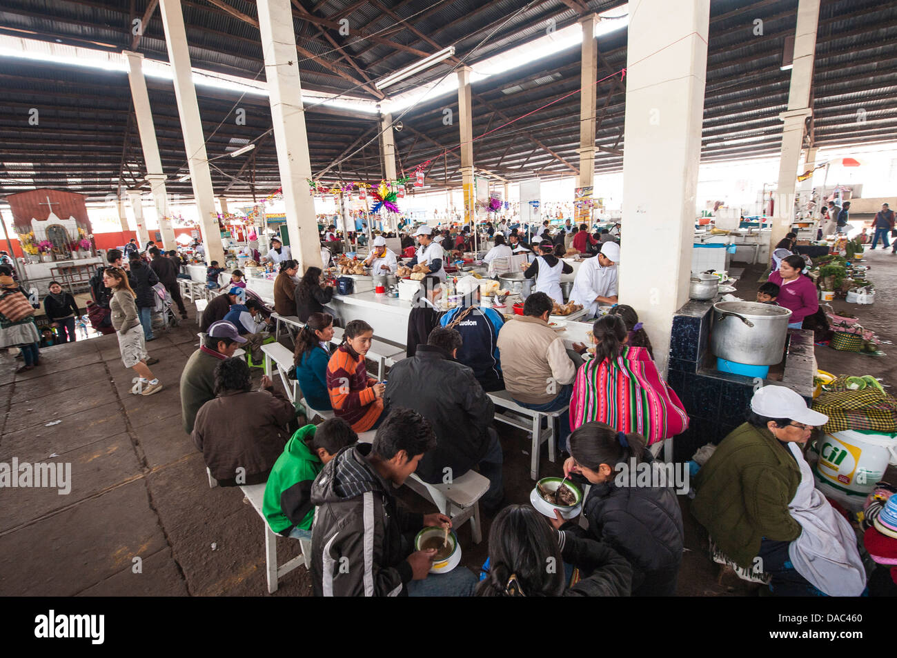 People eating counter restaurant at local covered produce central market downtown Cusco, Peru. Stock Photo
