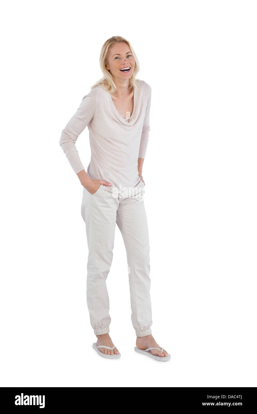 Laughing woman with hands in pockets Stock Photo