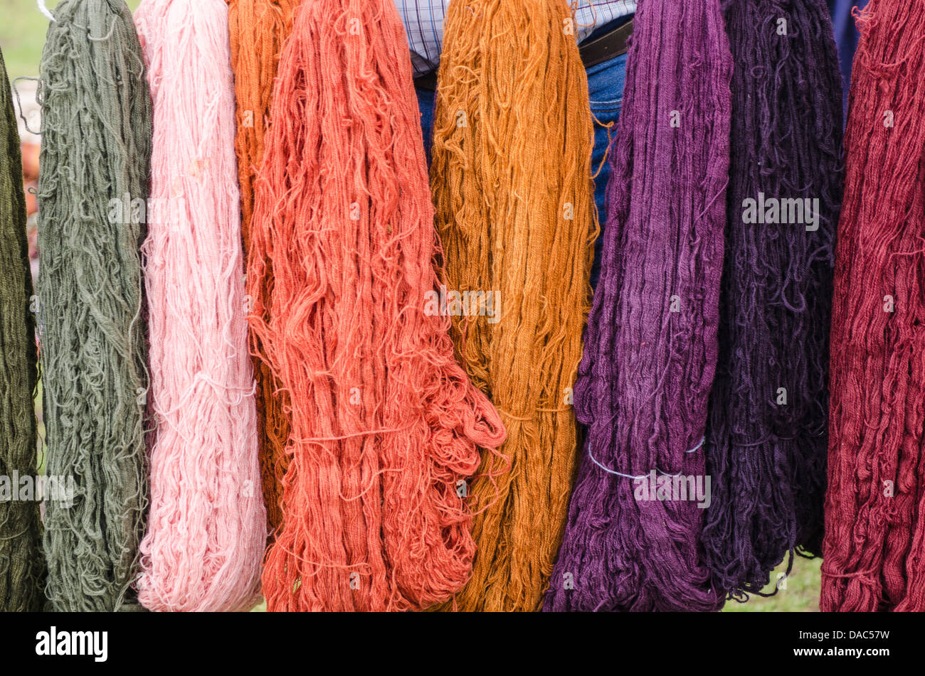 Colorful dyed llama wool textile yarn in Chinchero, Peru. Stock Photo