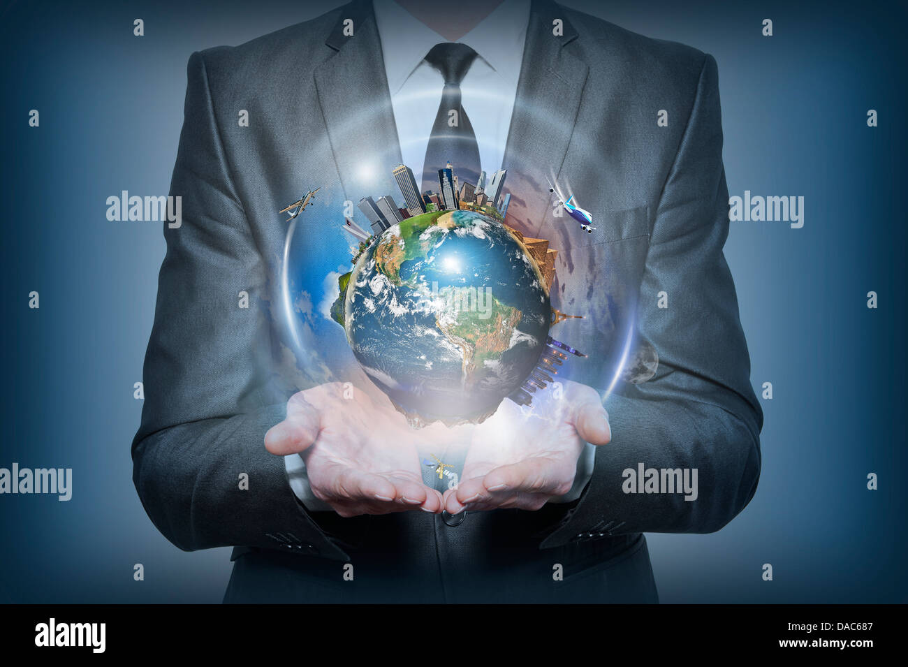Planet earth in human hands on blue background Stock Photo