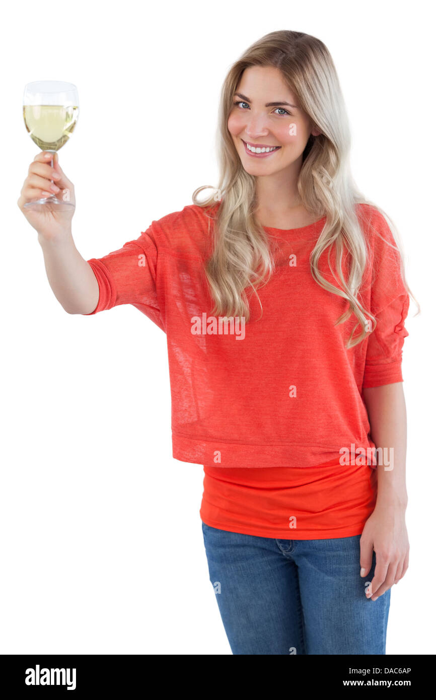 Smiling woman holding white wine glass Stock Photo - Alamy