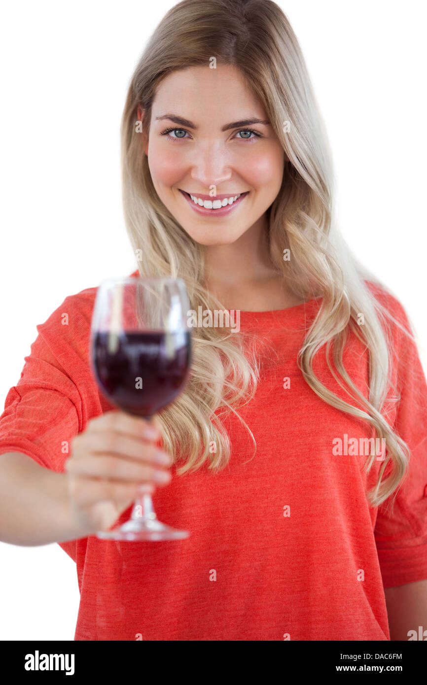 Woman holding red wine glass Stock Photo - Alamy