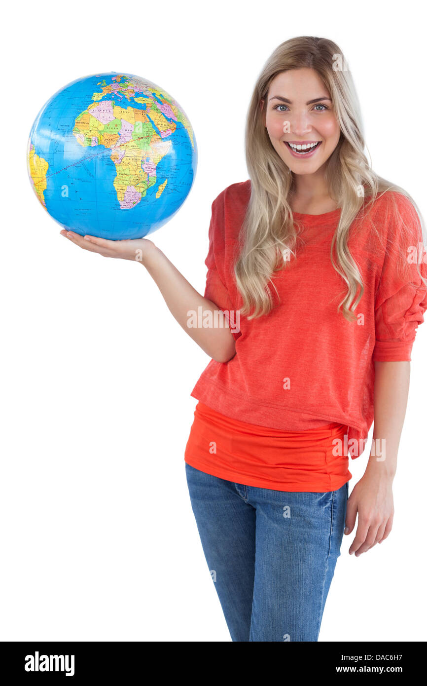 Cheerful woman holding globe Stock Photo