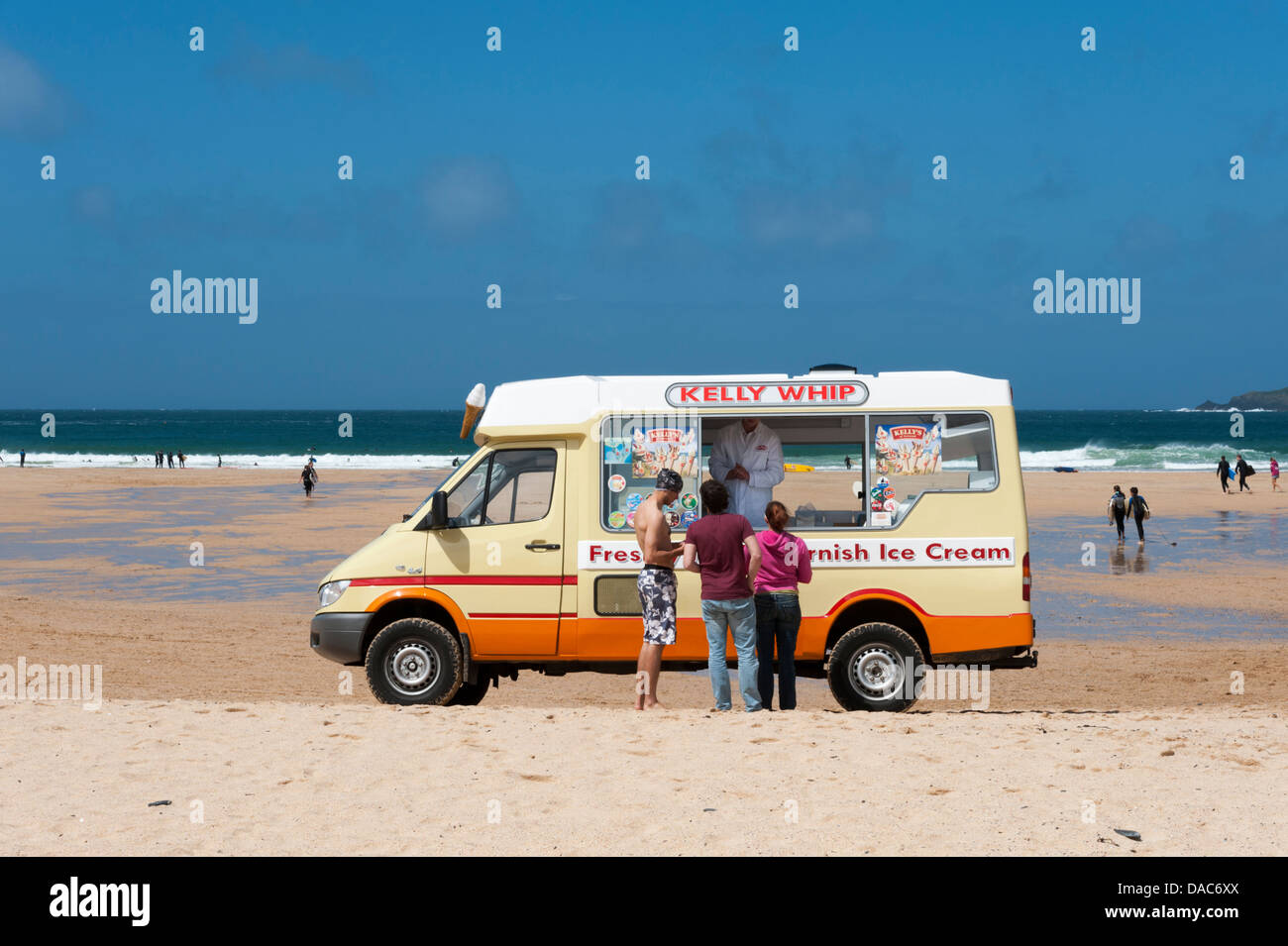 A Kelly's Cornish Ice cream Van on Harlyn Bay Cornwall UK on a sunny summer day with customers buying ices Stock Photo