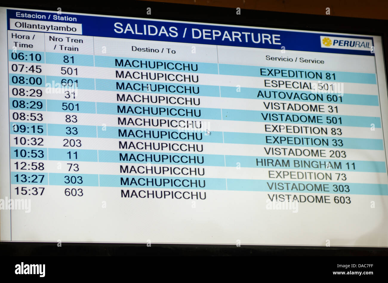 Train departure arrival board screen sign at the Ollantaytambo Train station in Ollantaytambo, Sacred Valley, Peru. Stock Photo