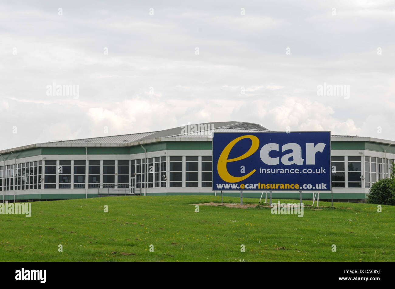 Old Severn Service Station now a call centre for E car insurance with a  large company sign in front of the listed building Stock Photo - Alamy