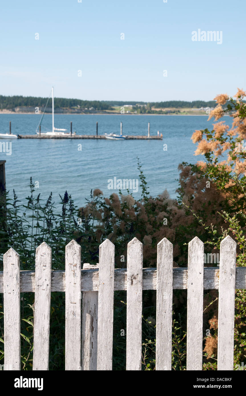 Picket fence overlooking harbor. Stock Photo