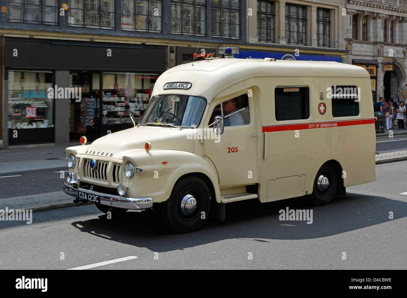 Old preserved City of Birmingham Bedford ambulance driving along the Strand in London Stock Photo