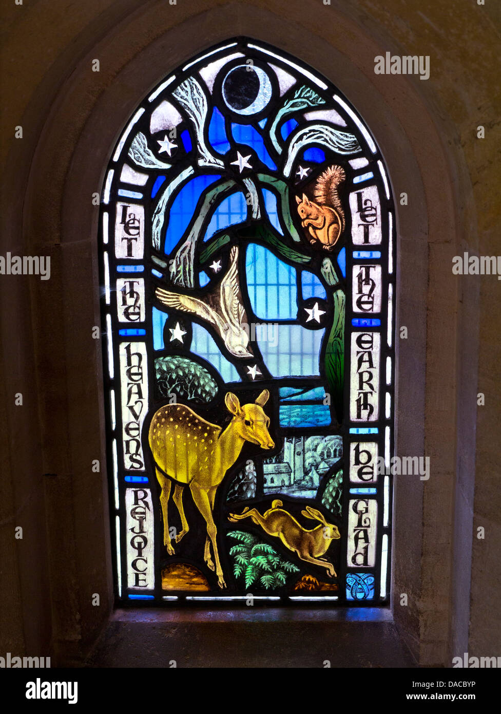 Contemporary stained glass window in rural country parish church featuring a variety of  countryside animal life Stock Photo