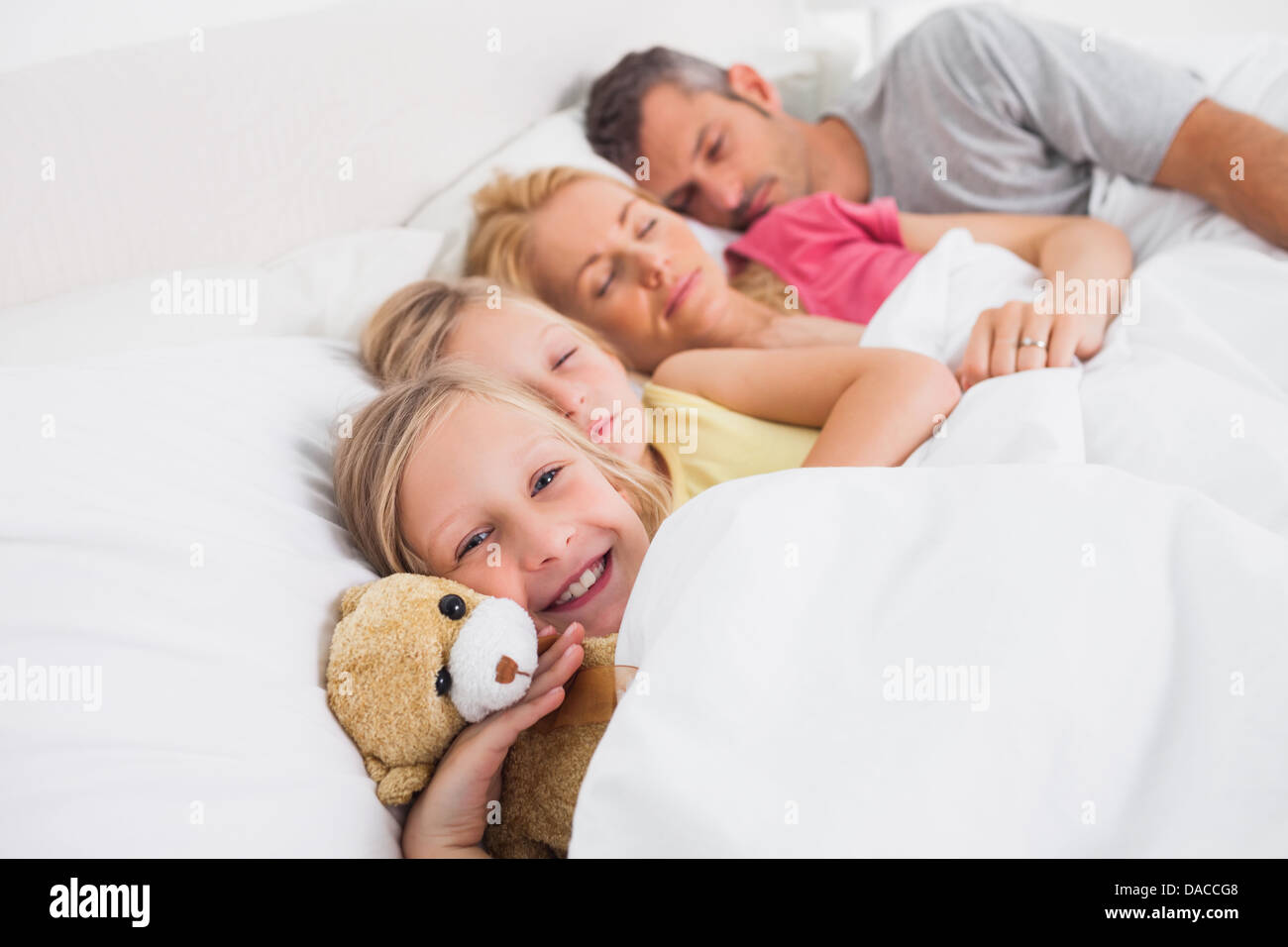 Parents sleeping with their daughters in bed Stock Photo Alamy