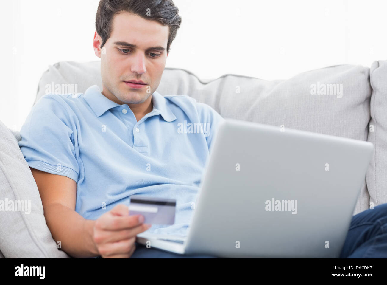 Attractive young man credit card hi-res stock photography and images ...