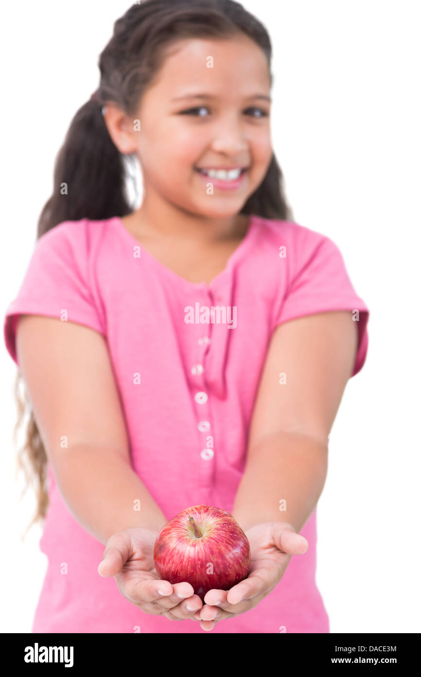 Little girl holding apple in her hands Stock Photo