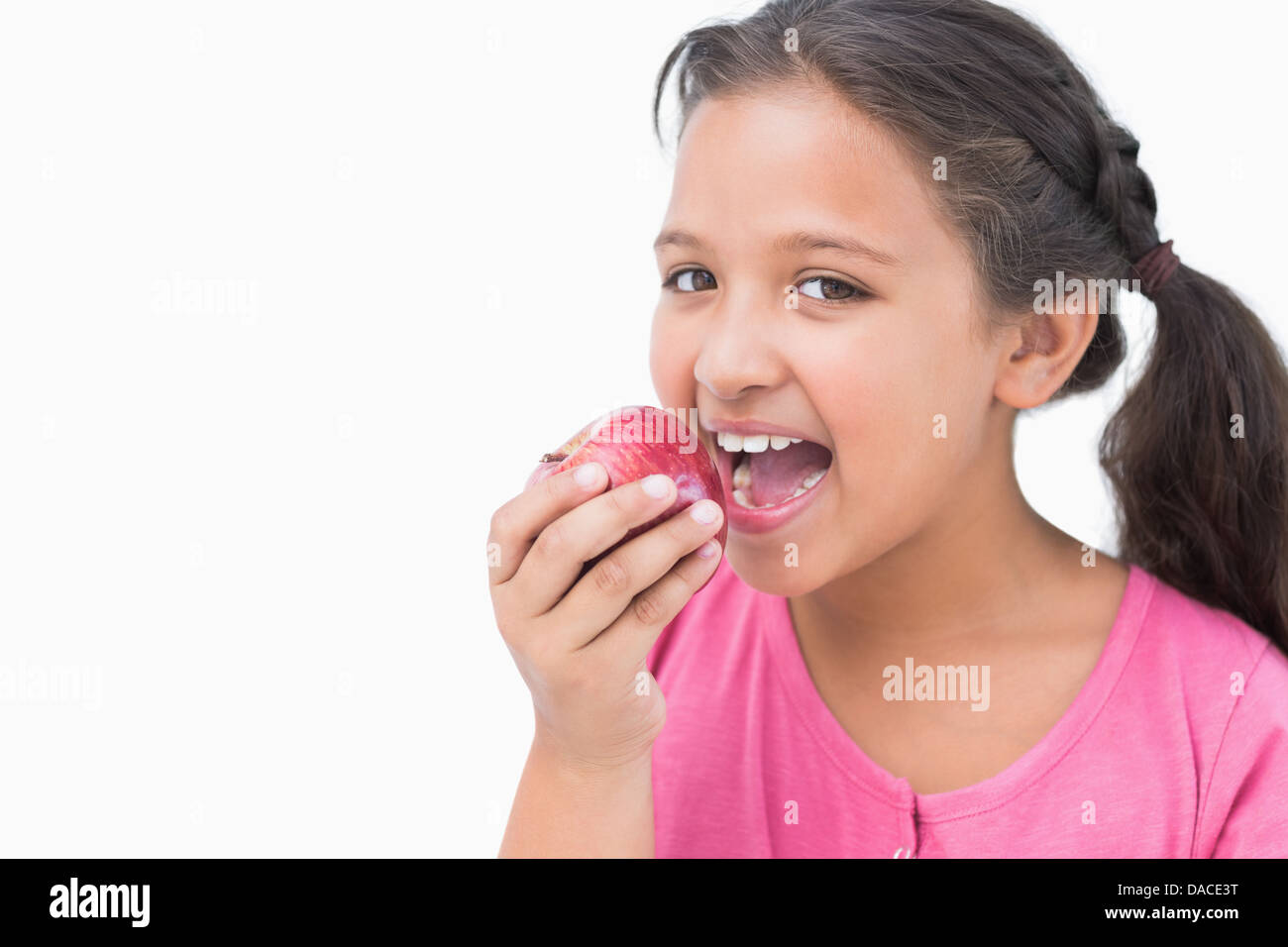 Little girl eating apple Stock Photo
