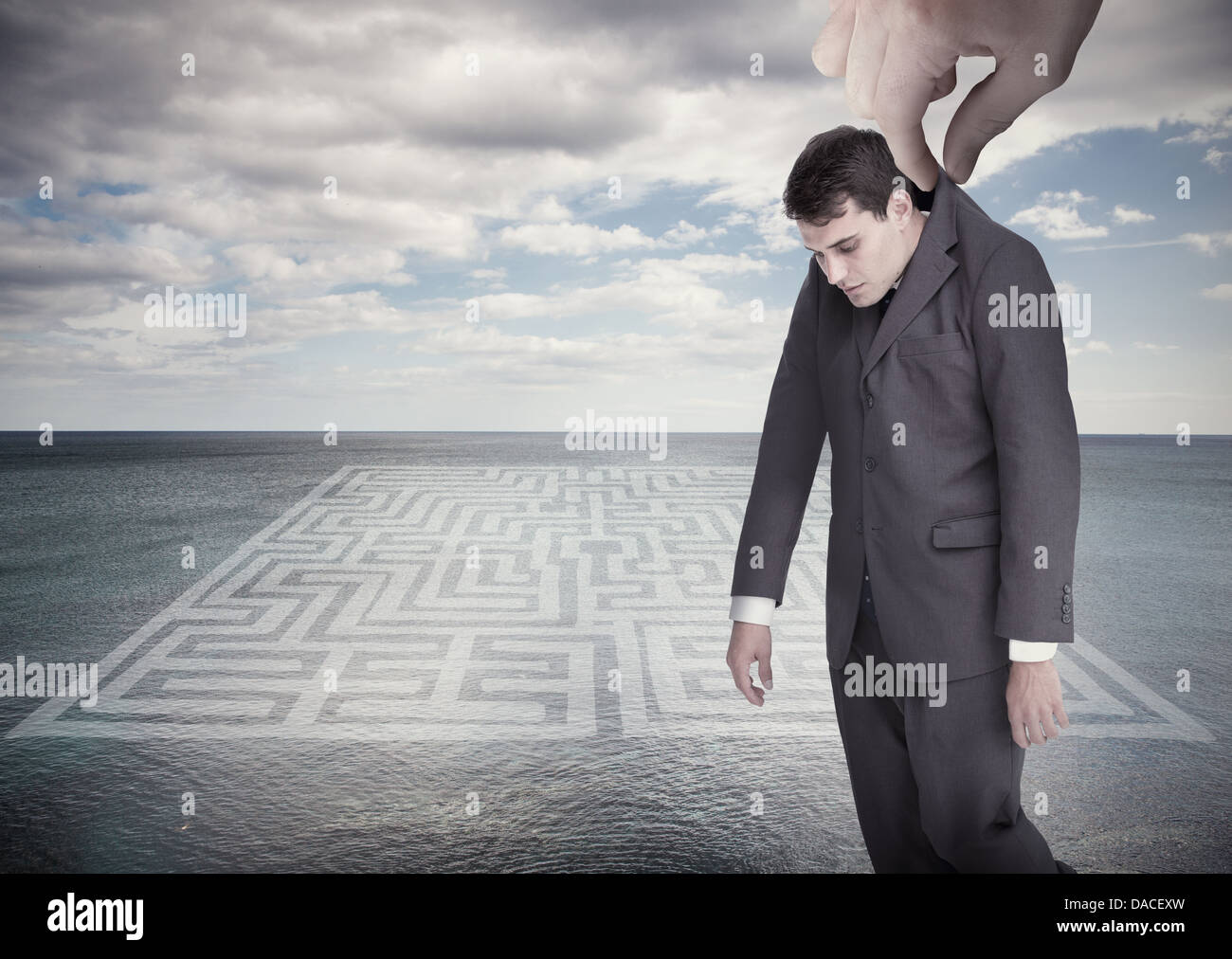 Giant hand dropping off a businessman Stock Photo - Alamy