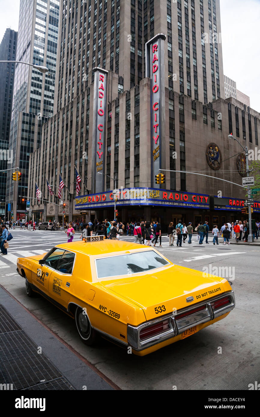 1970's New York yellow Taxi outside Radio City, NYC, USA. Stock Photo