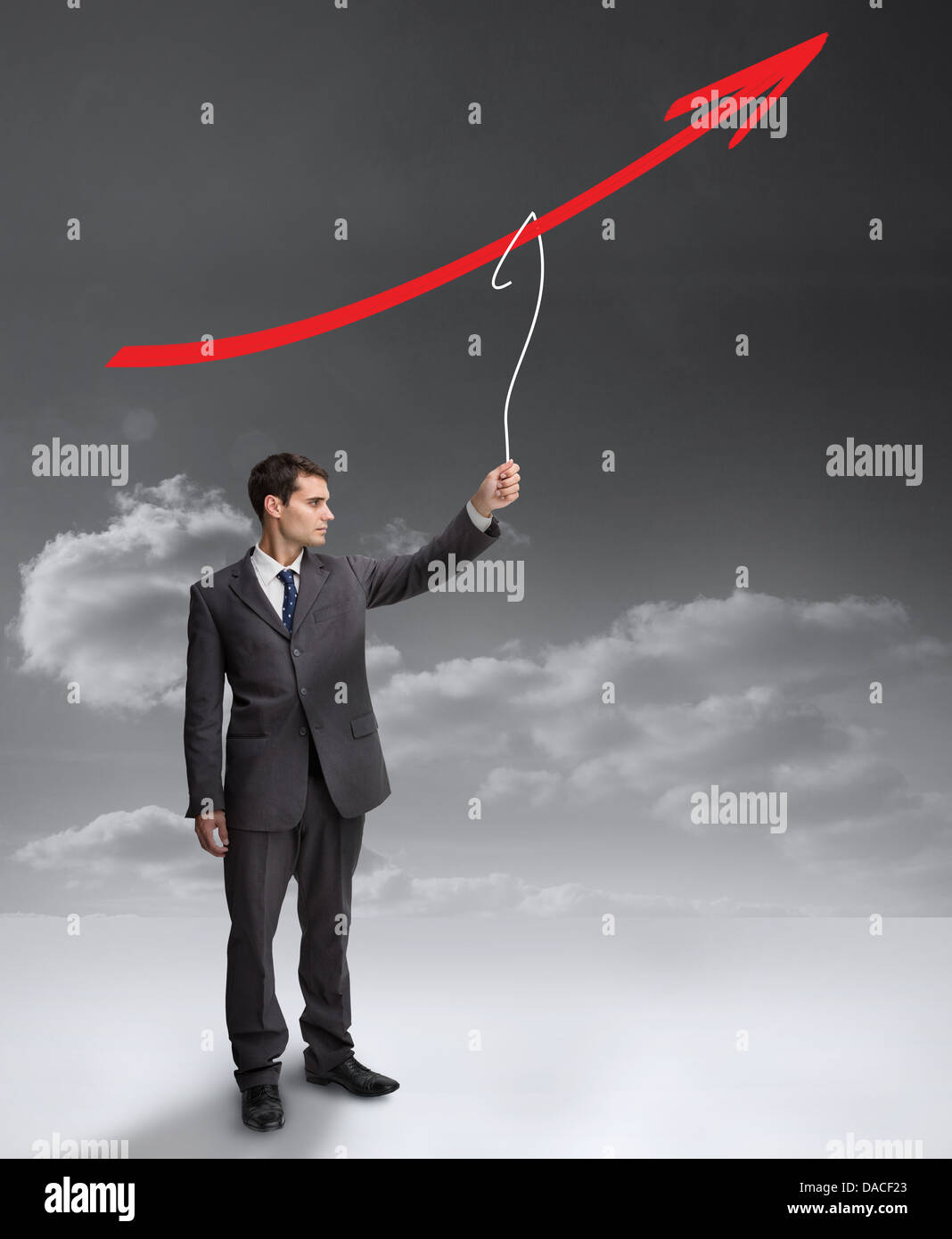 Businessman holding a drawing of a red arrow Stock Photo - Alamy