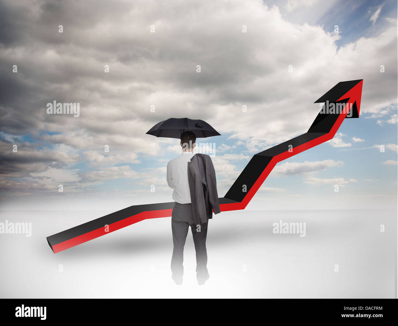 Businessman under an umbrella looking at a red arrow Stock Photo - Alamy