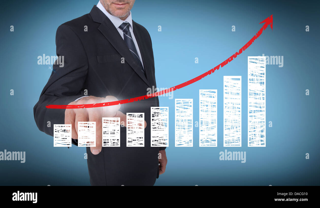 Businessman touching a chart with a red arrow pointing up Stock Photo ...