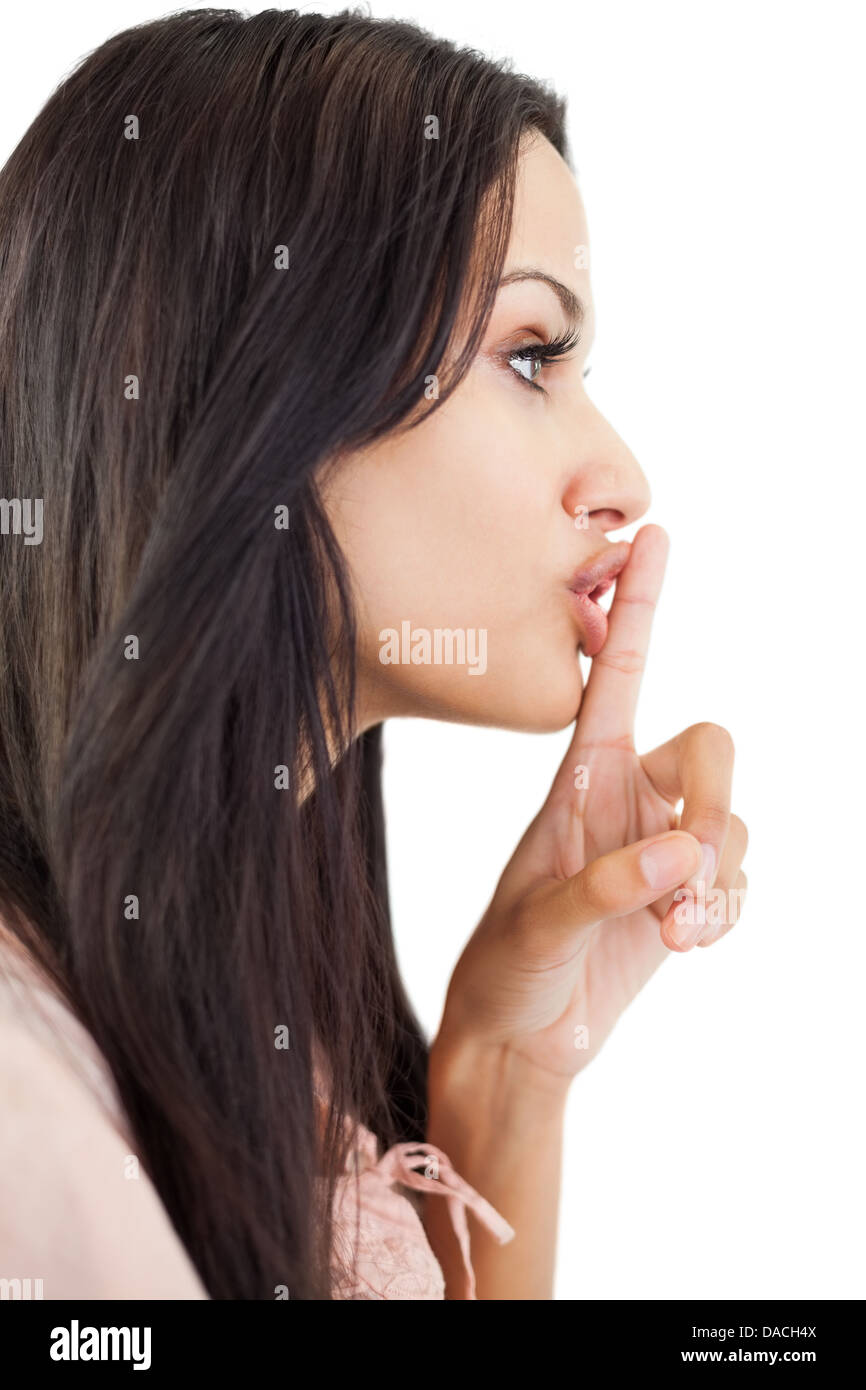 Woman making sign for quiet Stock Photo - Alamy