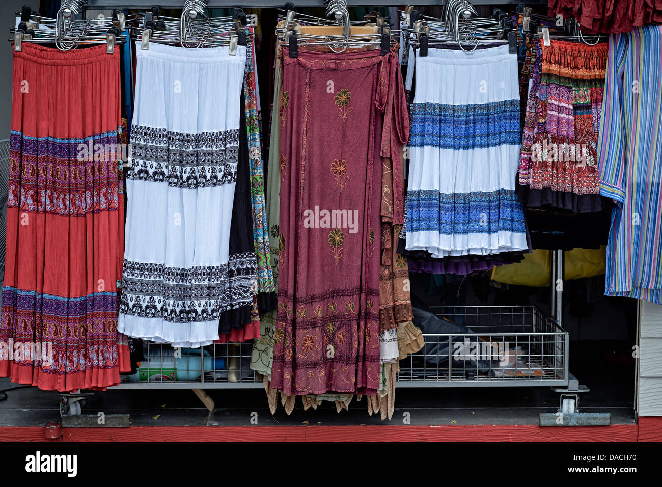 Colourful clothing. Shop display of brightly colored woman's skirts and casual dress. Thailand S. E. Asia Stock Photo