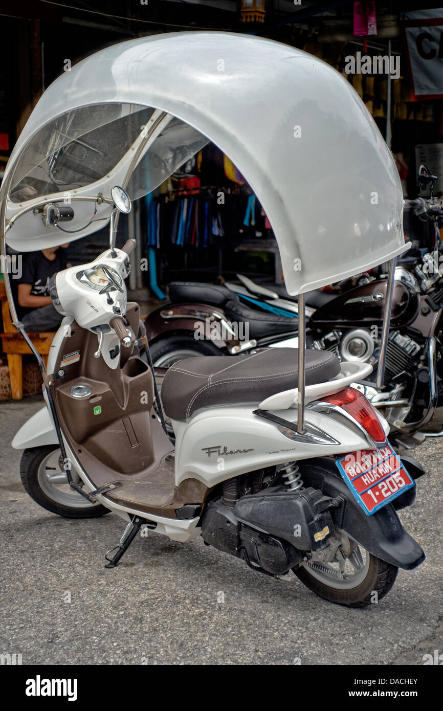 customized motorcycle with weather protecting canopy shield. Thailand S. E. Asia Stock Photo