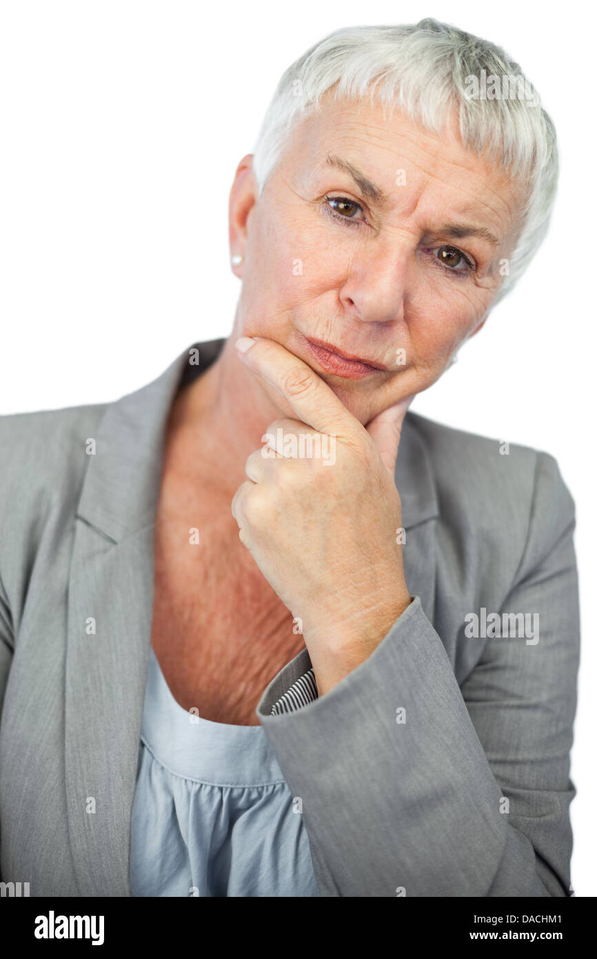 Thinking woman looking at camera Stock Photo