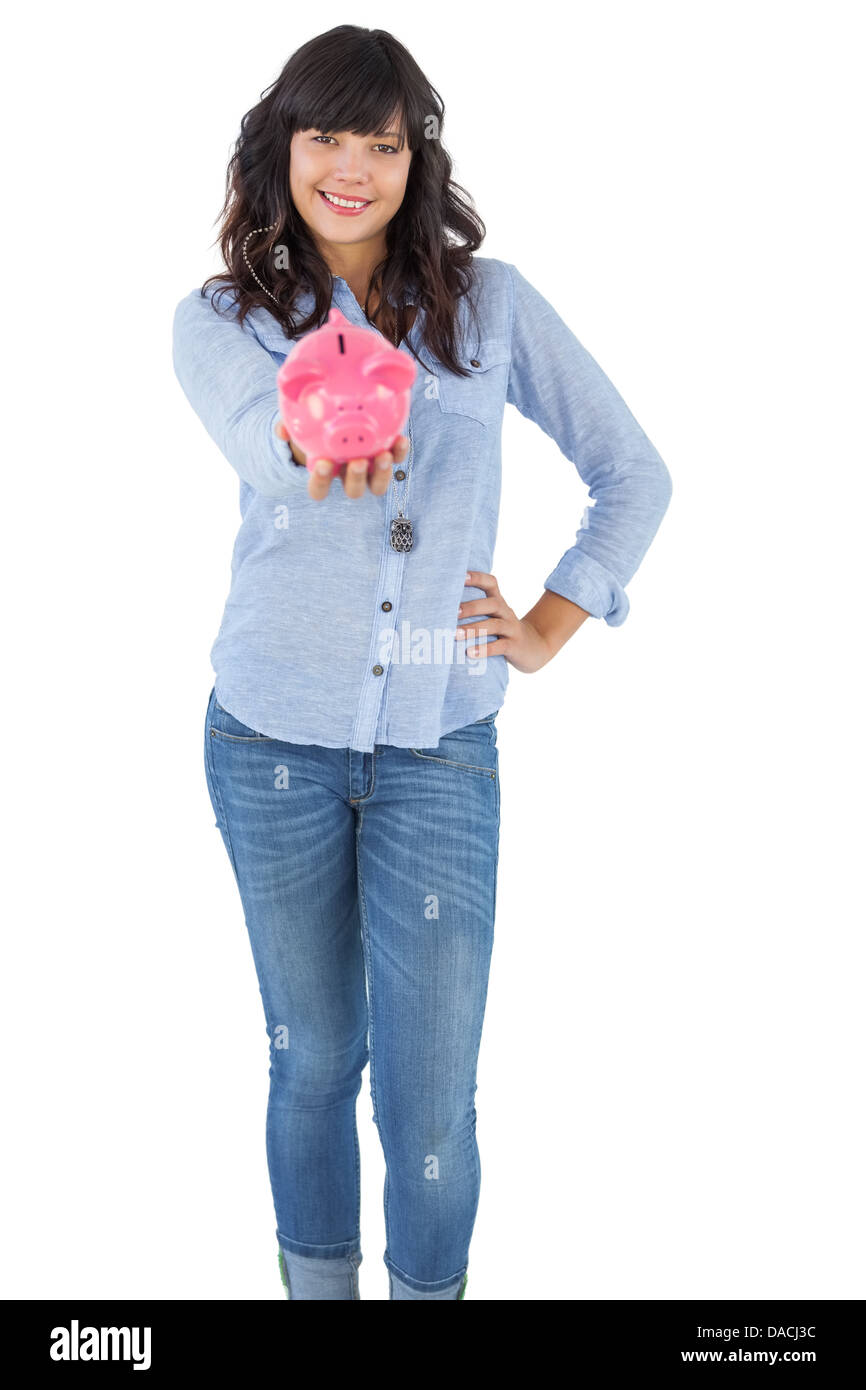 Young woman showing her piggy bank Stock Photo - Alamy