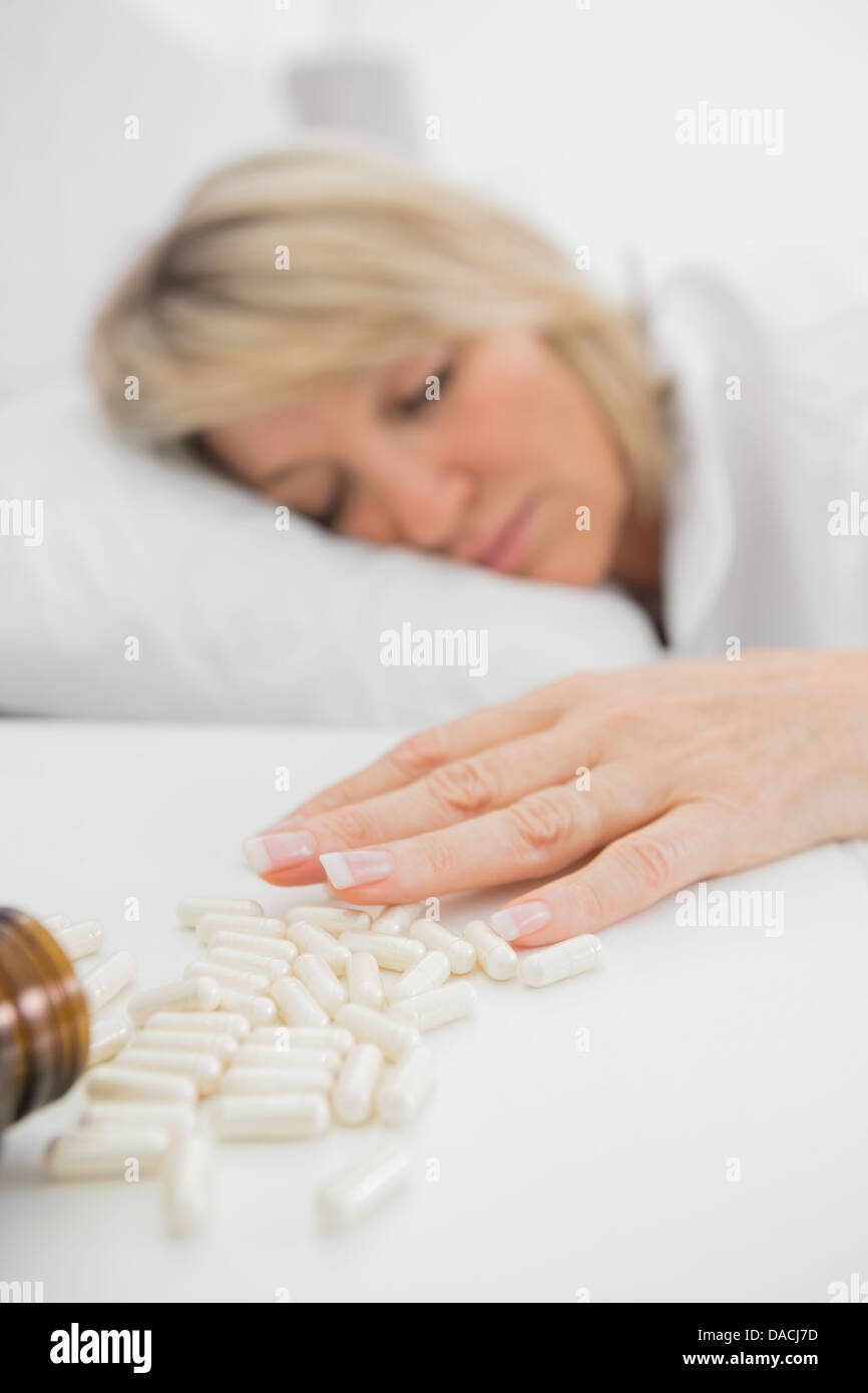 Woman lying motionless after overdose Stock Photo