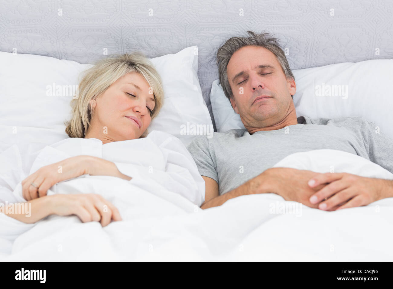 Couple Sleeping Peacefully In Their Bed Stock Photo Alamy