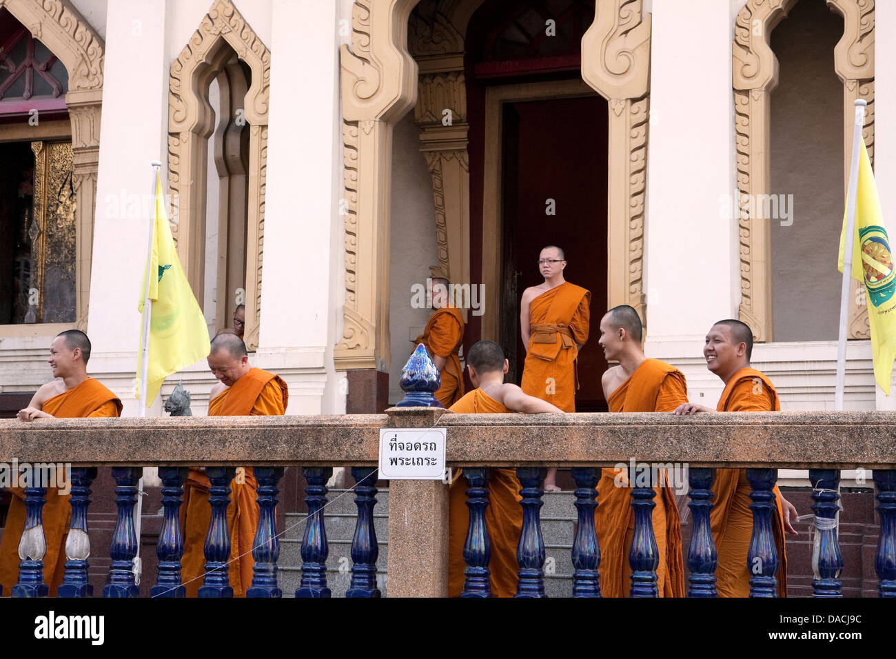 Monks at building entrance, Bangkok, Thailand Stock Photo