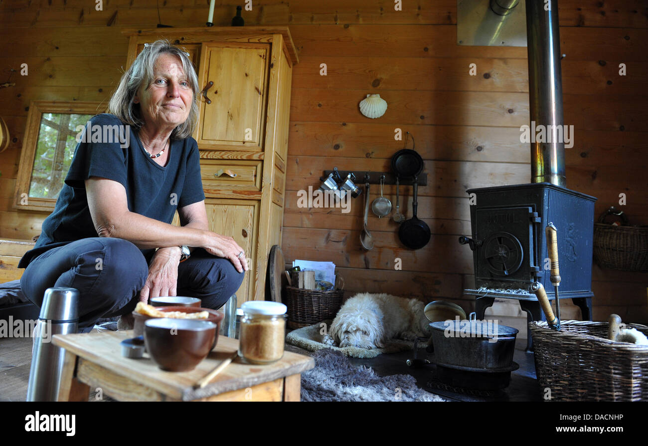 Anne Donath is pictured in her hut in Steinhausen, Germany, 14 September 2011. For 18 years now, she has been living on 16 square meters without water or electricity. Photo: Stefan Puchner Stock Photo