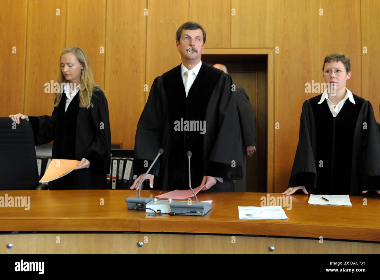 The presiding judge in the trial of the murder of ten year old Mirco, Herbert Luczak (C), stands in the courtroom at the regional court in Krefeld, Germany, 29 September 2011. The court found 45 year old Olaf H. guilty of the murder of the ten year old Mirco from Grefrath and sentenced him to life. Mirco was abducted on his way home on 03 September 2010. The manager admitted to the Stock Photo