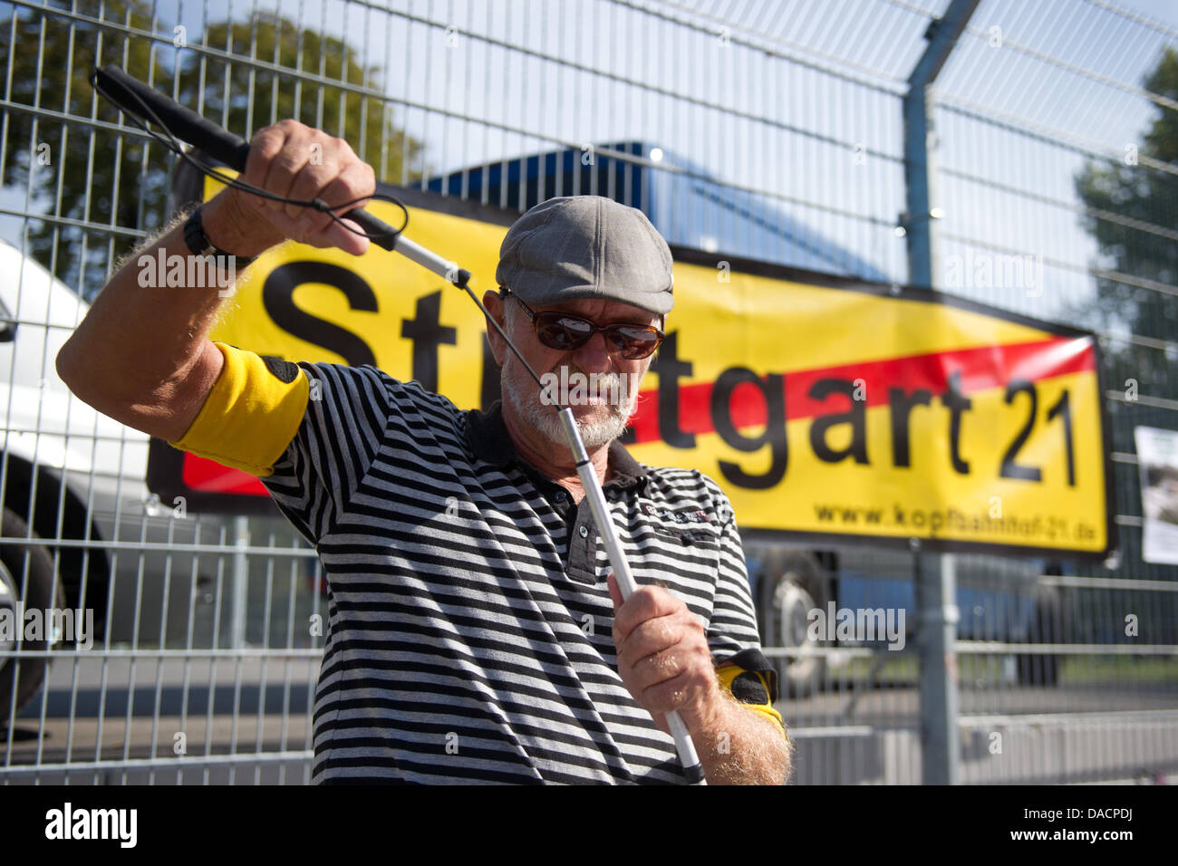 The Stuttgart 21 opposer whose eyes were seriously injured by a police intervention during a demonstration a year ago stands in the Schlossgarten with a blindman'S stick in Stuttgart, Germany, 29 September 2011. On 30 September, the day of the demonstration lies one year behind. The violence during the protest caused juridical action and public debates that are still ongoing. Photo Stock Photo
