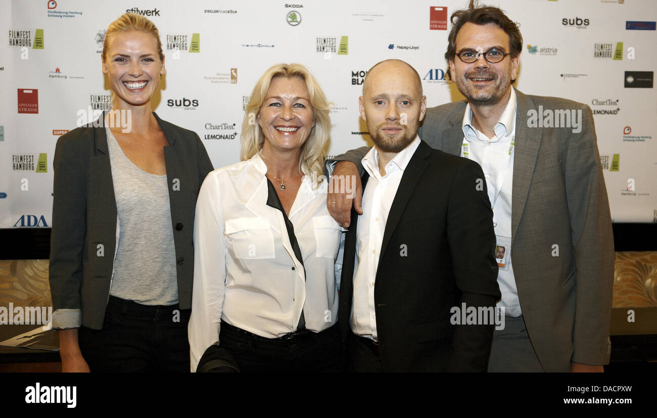 The actress Synnove Macody Lund (L-R), producer Marianne Gray, Norwegian actor Aksel Hennie and producer Asle Vatn arrive for the premiere of the movie 'Headhunters' during the Film festival Hamburg 2011 in Hamburg, Germany, 30 September 2011. Photo: Georg Wendt Stock Photo