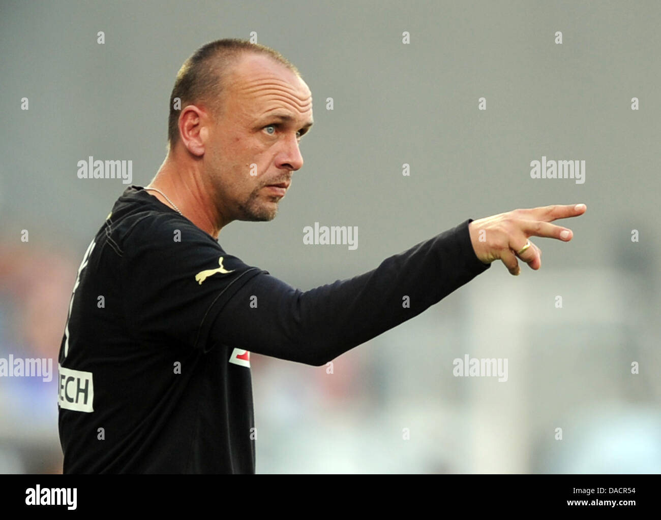 Hoffenheim's headcoach Holger Stanislawski gestures during the German Bundesliga soccer match between TSG 1899 Hoffenheim and FC Bayern Munich at Rhein-Neckar-Arena in Sinsheim, Germany, 01 October 2011. The macth ended 0-0. Photo: ULI DECK        (ATTENTION: EMBARGO CONDITIONS! The DFL permits the further  utilisation of the pictures in IPTV, mobile services and other new  technol Stock Photo