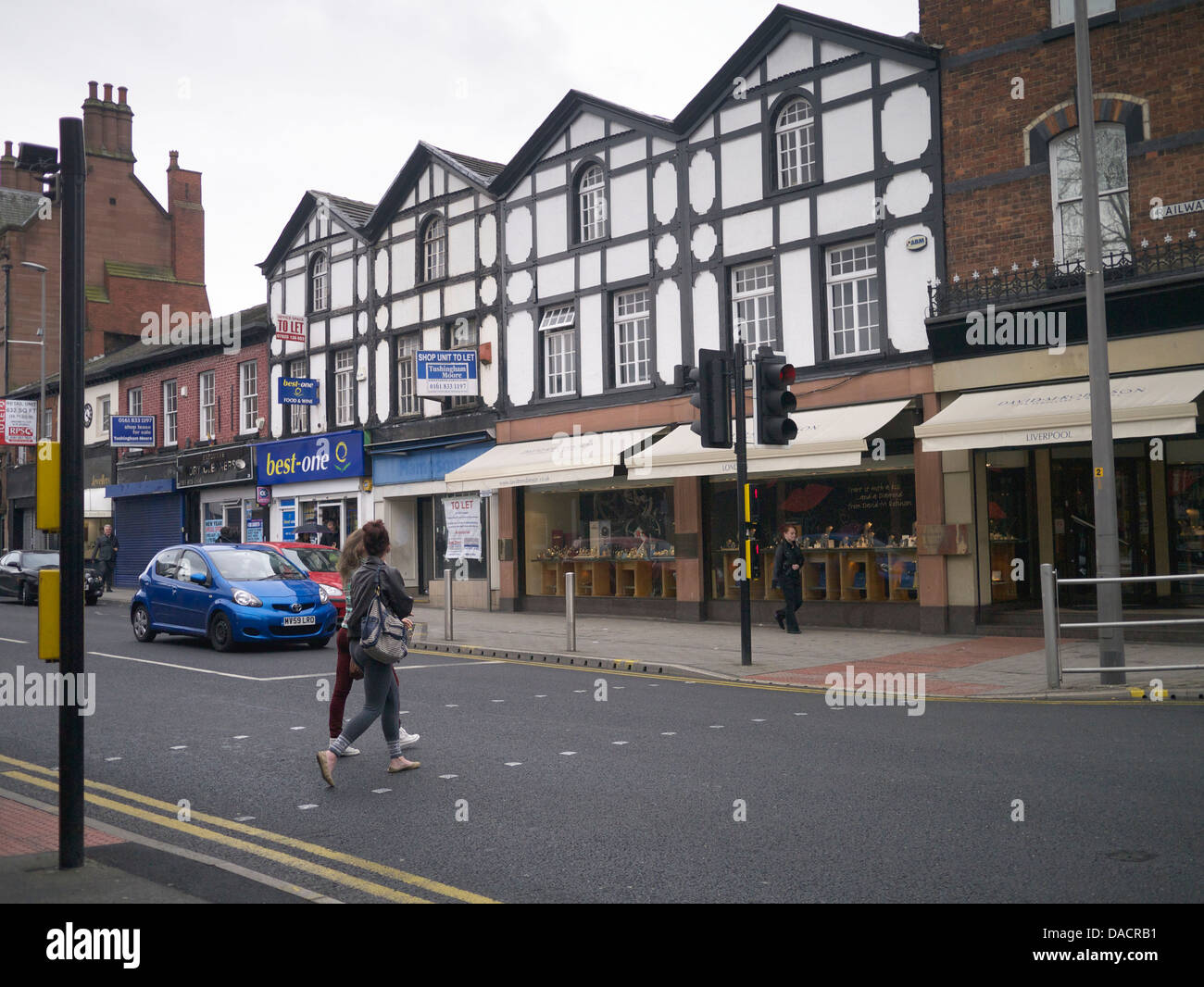 Girls crossing Stamford new Road, Altrincham Stock Photo Alamy