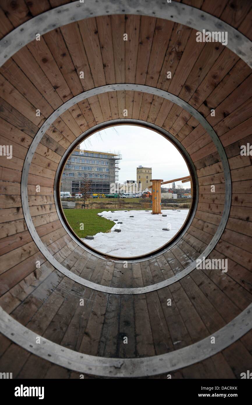 The premises of the State Horticultural Show 2012 and the 'Insula'-residence block are seen through a wooden play tunnel at the ERBA-Park in Bamberg, Germany, 13 December 2011. The construction works go well due to the mild weather. The State Horticultural Show will take place in Bamberg from 26 April to 7 October 2012. Photo: DAVID EBENER Stock Photo