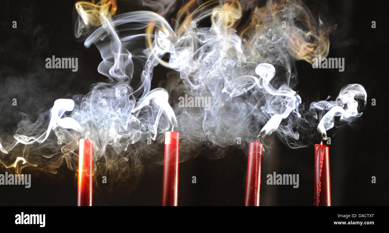 Smoking candles are pictured in a lecture hall of the university in