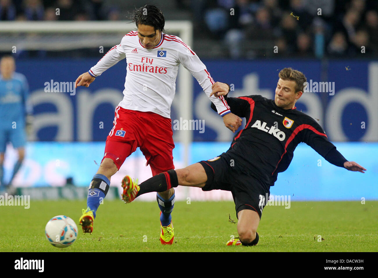 Hamburg's Jose Paolo Guerrero (L) vies for the ball with Augsburg's Daniel Baier during the German Bundesliga match between Hamburger SV and FC Augsburg at Imtech Arena in Hamburg, Germany, 17 December 2011. Photo: MALTE CHRISTIANS  (ATTENTION: EMBARGO CONDITIONS! The DFL permits the further utilisation of the pictures in IPTV, mobile services and other new technologies only no ear Stock Photo